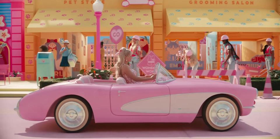 Margot Robbie's Stereotypical Barbie driving in "Barbie."
