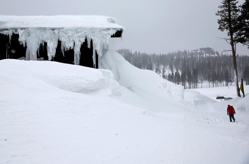 A person walks at Boreal Mountain Resort, currently shuttered due to the snowstorm, following a massive snowstorm in the Sierra Nevada mountains on March 04, 2024 at Soda Springs, California (Getty Images)