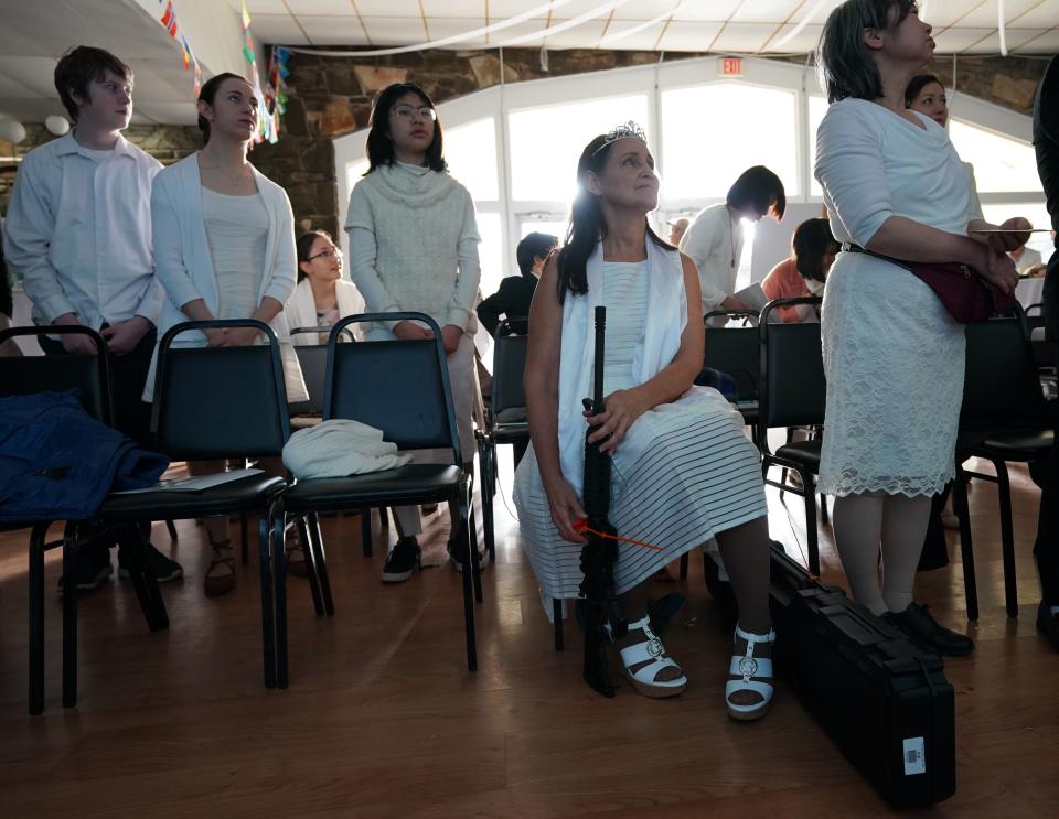 <p>Worshippers at World Peace and Unification Sanctuary hold weapons during their service February 28, 2018 in New Foundland, Pennsylvania.<br> (Photo: Don Emmert/AFP/Getty Images) </p>