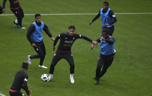 Peru's forward Paolo Guerrero (C) vies for the ball with teammates during a training session at the Arena Khimki stadium, outside Moscow, on June 11, 2018, ahead of the Russia 2018 World Cup