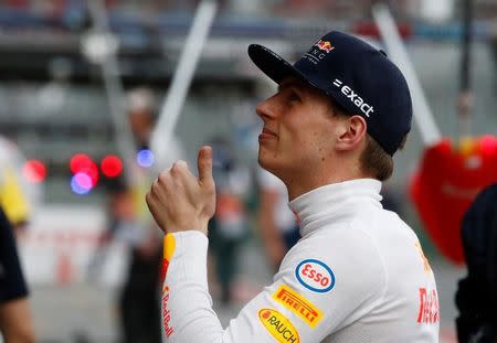 Formula One - F1 - Australian Grand Prix - Melbourne, Australia - 25/03/2017 Red Bull Racing driver Max Verstappen of the Netherlands gives a thumbs up to fans before the start of the qualifying session. REUTERS/Brandon Malone