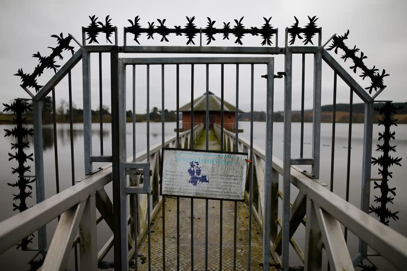 A sign hangs on a gate at Severn Trent Water's Cropston Reservoir