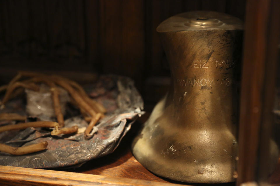 Candles and a small bell recovered from the original St. Nicholas Greek Orthodox Church, destroyed in the Sept. 11, 2001 attacks, are preserved at the Greek Orthodox Archdiocese of America in New York on Wednesday, Aug. 18, 2021. (AP Photo/Jessie Wardarski)