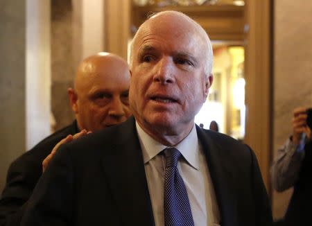 U.S. Senator John McCain (R-AZ) leaves after Senator Dianne Feinstein's (D-CA) speech on the Senate floor on Capitol Hill, in Washington December 9, 2014. REUTERS/Yuri Gripas