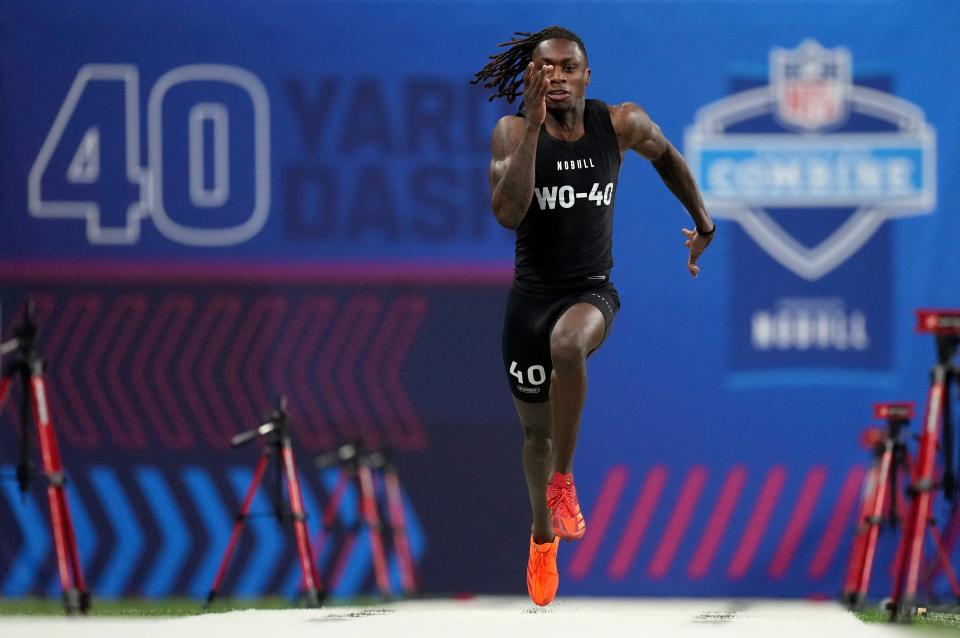 Mar 2, 2024; Indianapolis, IN, USA; Texas wide receiver Xavier Worthy (WO40) ran an official time of 4.21 seconds to set a combine record during the 2024 NFL Combine at Lucas Oil Stadium. Mandatory Credit: Kirby Lee-USA TODAY Sports