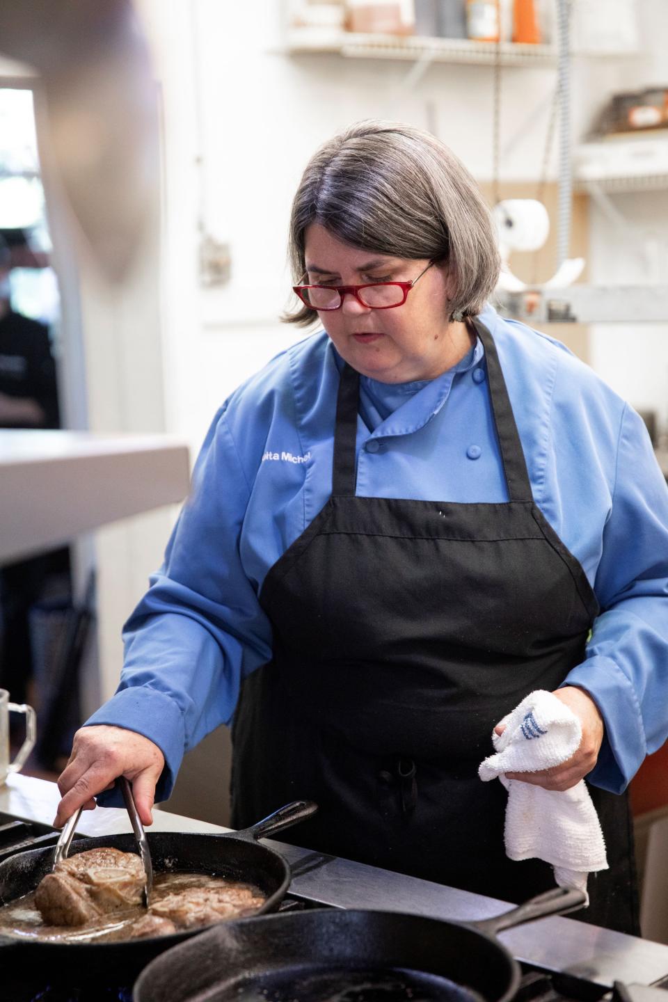Chef Ouita Michel, owner at Holly Hill Inn, prepares Rose Beef Shank at her restaurant.