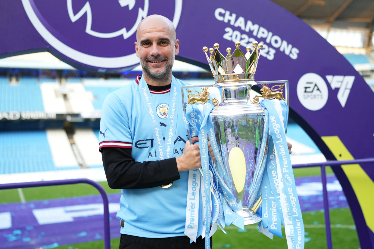 MANCHESTER, ENGLAND - MAY 21: Pep Guardiola, Manager of Manchester City, poses for a photograph with the Premier League Trophy following the Premier League match between Manchester City and Chelsea FC at Etihad Stadium on May 21, 2023 in Manchester, England. (Photo by Tom Flathers/Manchester City FC via Getty Images)