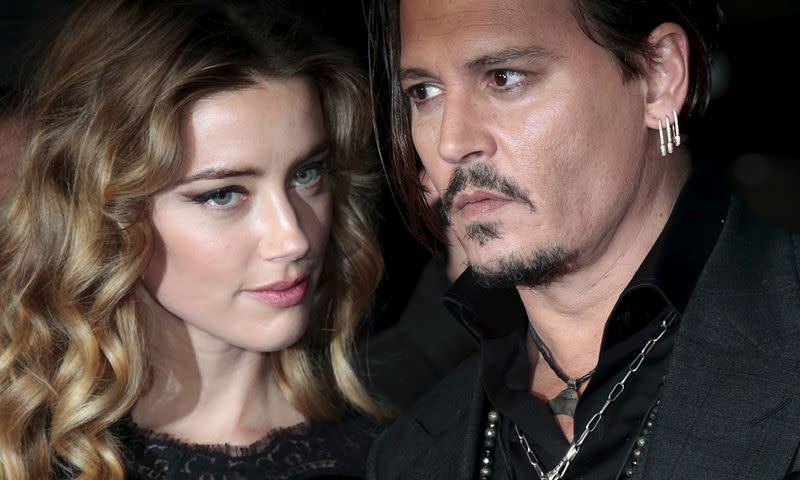 FILE PHOTO: Cast member Johnny Depp and his actress wife Amber Heard arrive for the British premiere of the film "Black Mass" in London