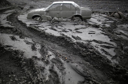 A flood-damaged Opel Astra is seen in Topcic Polje, May 20, 2014. REUTERS/Dado Ruvic