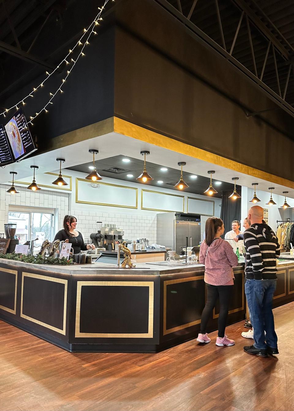 The stylish entrance and coffee counter at Pioneer Coffee Co. in Massillon.