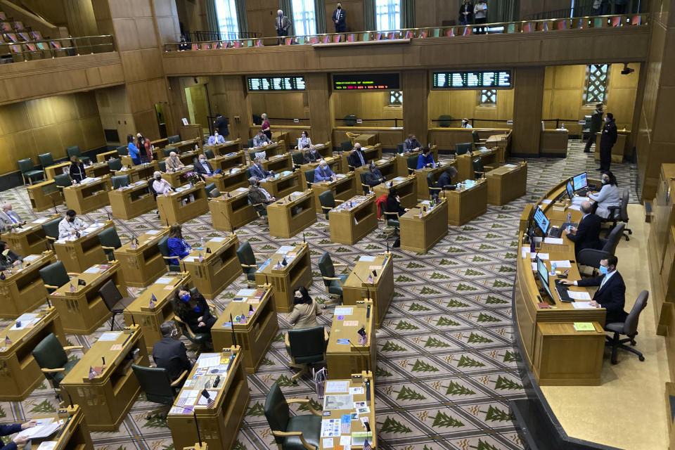 The Oregon House of Representatives get set to open a session on the evening of Thursday, June 10, 2021, to consider expelling member Rep. Mike Nearman for letting violent protesters into the Oregon Capitol in December. Republican lawmakers voted with majority Democrats to take the historic step of expelling the Republican member who let violent, far-right protesters into the state Capitol on Dec. 21. (AP Photo/Andrew Selsky)