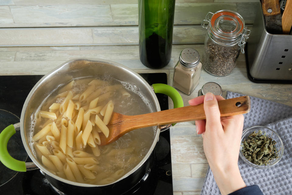 Cooking penne pasta.
