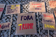 <p>Signs are seen on the sidewalk as demonstrators gather to protest against US President Donald Trump in front of the US Embassy on January 21, 2017 in Lisbon, Portugal. Simultaneous protests have been staged, mainly by women, in many different countries against Trump’s behavior to women. (Horacio Villalobos – Corbis/Corbis via Getty Images) </p>