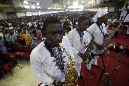 Choir members play saxophones during a church service at the auditorium of the Living Faith Church, also known as the Winners' Chapel, in Ota district, Ogun state, some 60 km (37 miles) outside Nigeria's commercial capital Lagos September 28, 2014. REUTERS/Akintunde Akinleye