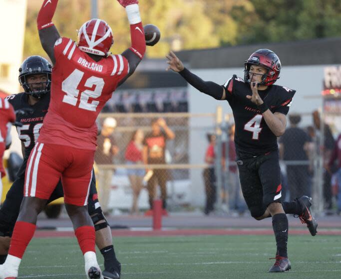 CORONA, CA - AUGUST 18: Centennial quarterback Husan Longstreet passes in the first quarter during season opener against Mater Dei at Corona Centennial High School on Friday, Aug. 18, 2023 in Corona, CA. (Myung J. Chun / Los Angeles Times)