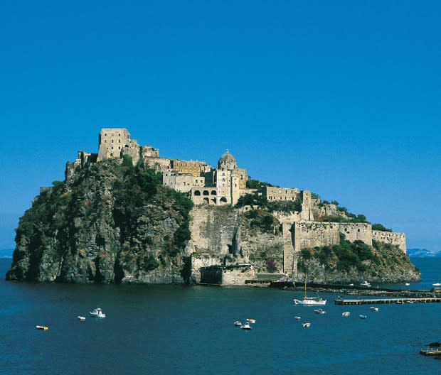 <p>Courtesy Image</p><p>If you watched <em>Game of Thrones</em>, you’re familiar with Castello Aragonese. The inspiration for House Greyjoy of Pyke is a hilltop fortress that offers stunning views over the Gulf of Naples. Located on its own small island connected to Ischia (one of the Phlegraean Islands), its history as a fortress traces all the way back to the 5th century when Hiero of Syracuse built the first castle there.</p><p>The hotel, <a href="https://en.albergoilmonastero.it/" rel="nofollow noopener" target="_blank" data-ylk="slk:Albergo il Monastero;elm:context_link;itc:0;sec:content-canvas" class="link ">Albergo il Monastero</a>, offers two dining options: the Cafeteria, where guests can enjoy coffee, tea, cappuccino, ice creams and cool drinks, as well as salads, pizzas, “zingaras” (a special Ischian sandwich), and homemade cakes; La Cucina Del Monastero offers guests a chance to discover the flavors of southern Italy.</p><p>Guest rooms range from the simple, yet beautiful Standard Room to Suite l’Altana, which offers two large private terraces overlooking the entire island, floors covered by handmade terracotta typical of 18th-century Campanian style, and two bathrooms coated with handmade majolica tiles. Guests can also choose to dine by candlelight on the terrace with exclusive service and preferential access to the garden and solarium terraces. </p><p>Closest airport: Naples.</p><p>[<span>booking.com</span>]</p>