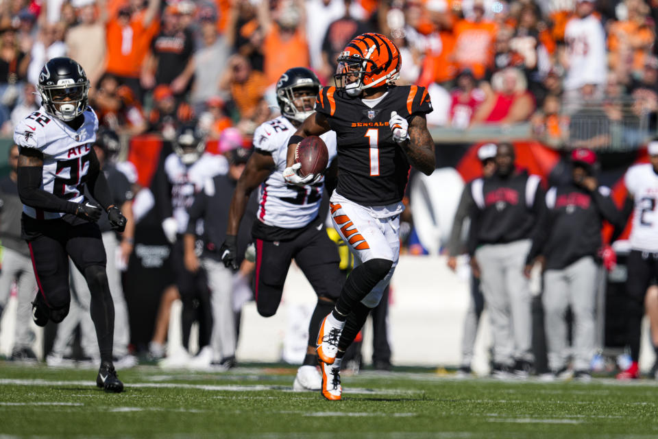 Cincinnati Bengals wide receiver Ja'Marr Chase (1) runs for a touchdown after a catch against the Atlanta Falcons in the first half of an NFL football game in Cincinnati, Sunday, Oct. 23, 2022. (AP Photo/Jeff Dean)