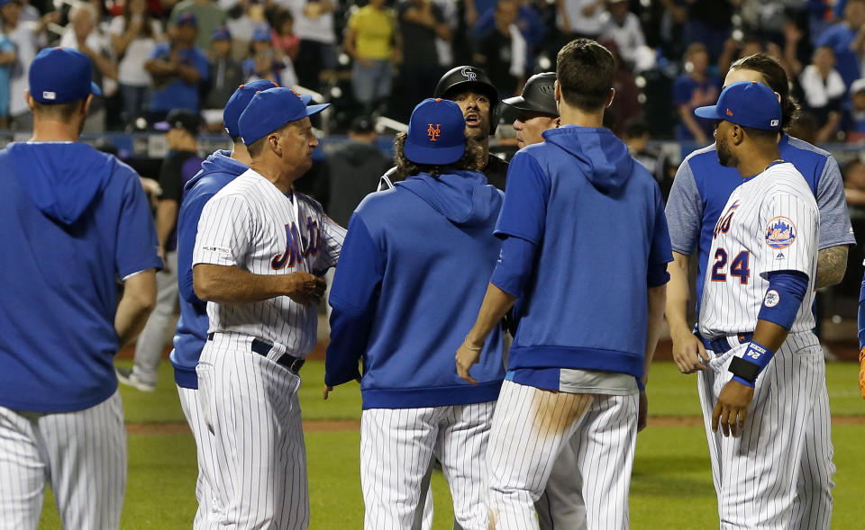 NEW YORK, NEW YORK - JUNE 07:   Ian Desmond #20 of the Colorado Rockies has words with members of the New York Mets after he was hit by a pitch during the eighth inning and the benches cleared at Citi Field on June 07, 2019 in New York City. (Photo by Jim McIsaac/Getty Images)