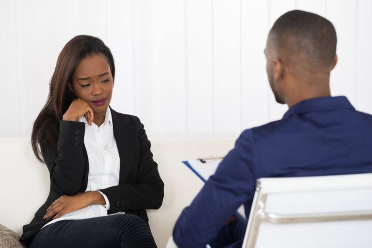 <span class="caption">Women still benefit economically from therapy - but 5% less than men.</span> <span class="attribution"><a class="link " href="https://www.shutterstock.com/image-photo/depressed-african-american-woman-psychiatrist-appointment-406480420" rel="nofollow noopener" target="_blank" data-ylk="slk:Andrey_Popov/Shutterstock;elm:context_link;itc:0;sec:content-canvas">Andrey_Popov/Shutterstock</a></span>