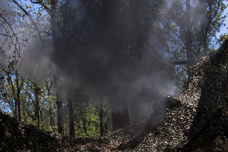 Ukrainian servicemen fire a M119 howitzer towards Russian troops at a position near a frontline in Donetsk region