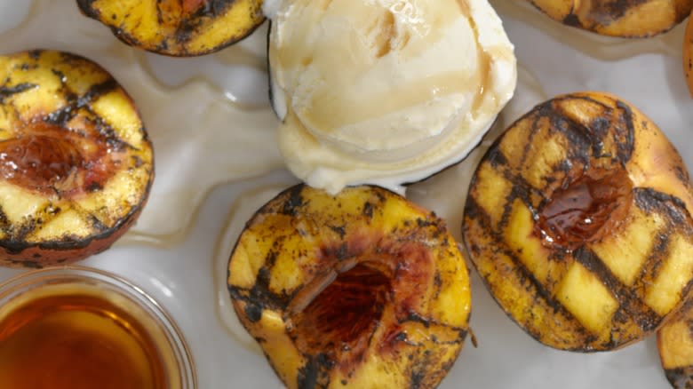 Grilled fruit with ice cream and glaze