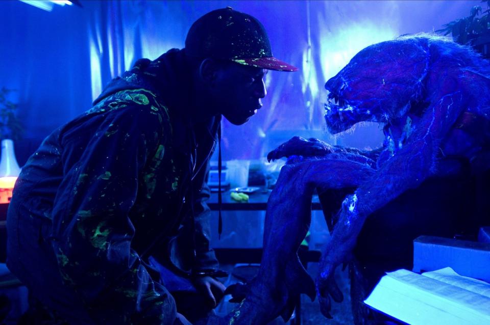 John Boyega examines the corpse of an alien invader in “Attack the Block”