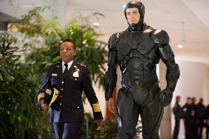 This image released by Columbia Pictures shows Marianne Jean-Baptiste, left, and Joel Kinnaman in a scene from "RoboCop." (AP Photo/Columbia Pictures - Sony, Kerry Hayes)