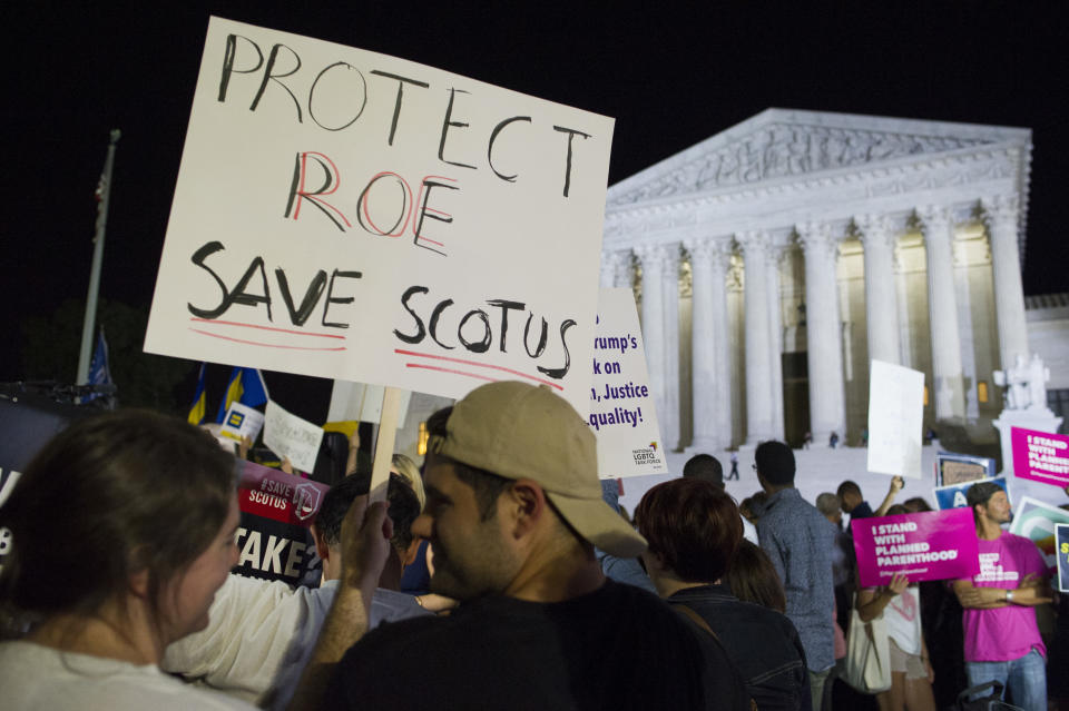 Protesters gathered in front of the Supreme Court on Monday evening after President Trump announced Brett Kavanaugh as his Supreme Court nominee. (Photo: Cliff Owen/AP)