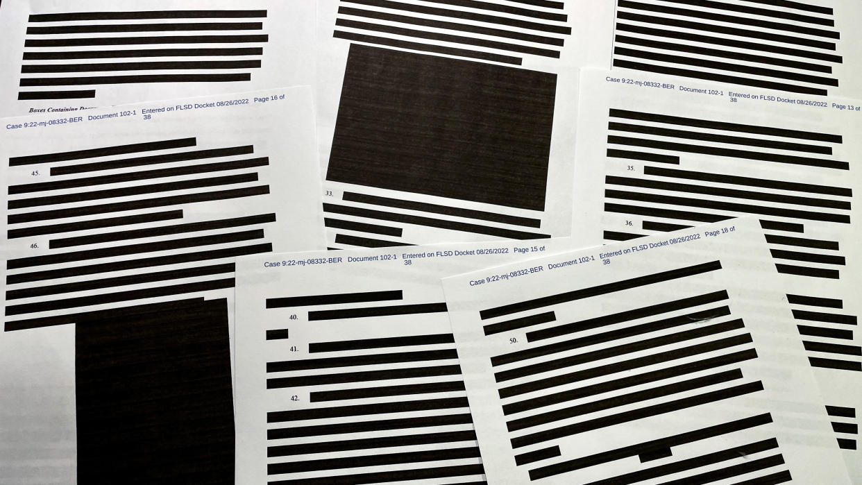 Pages of redacted information in the released version of the Mar-a-lago search affidavit have numerous lines of text blacked out.
