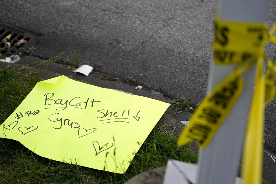 A sign lies on the ground across from the shuttered Xpress Mart Shell station in Columbia, S.C., Friday, June 2, 2023. Rick Chow, owner of the station, is accused of killing Carmack-Belton on Sunday night after chasing down the teenager, who he wrongly suspected of stealing four water bottles. (AP Photo/Erik Verduzco)