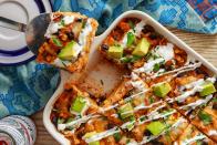 <p>Instead of rolling all of the <a href="https://www.delish.com/cooking/recipe-ideas/a49105/cheesy-chicken-enchiladas-recipe/" rel="nofollow noopener" target="_blank" data-ylk="slk:enchiladas;elm:context_link;itc:0;sec:content-canvas" class="link ">enchiladas</a>, this <a href="https://www.delish.com/cooking/g1702/casserole-recipes/" rel="nofollow noopener" target="_blank" data-ylk="slk:casserole;elm:context_link;itc:0;sec:content-canvas" class="link ">casserole</a> untraditionally speeds up the process by layering everything together in the pan. Skip the store-bought and make your own <a href="https://www.delish.com/cooking/recipe-ideas/a25837054/enchilada-sauce-recipe/" rel="nofollow noopener" target="_blank" data-ylk="slk:homemade enchilada sauce;elm:context_link;itc:0;sec:content-canvas" class="link ">homemade enchilada sauce</a>—you can adjust the heat up or down according to your preference and the flavor is 10x better.</p><p>Get the <strong><a href="https://www.delish.com/cooking/recipe-ideas/a22654914/enchilada-casserole-recipe/" rel="nofollow noopener" target="_blank" data-ylk="slk:Chicken Enchilada Casserole recipe;elm:context_link;itc:0;sec:content-canvas" class="link ">Chicken Enchilada Casserole recipe</a>.</strong></p>