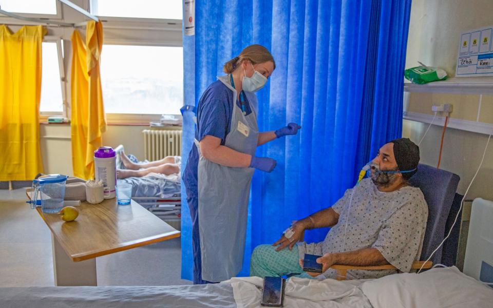 Covid Matron Gill Burnell speaking with patient Jasbir Singh, 51  - Heathcliff O'Malley for the Telegraph 