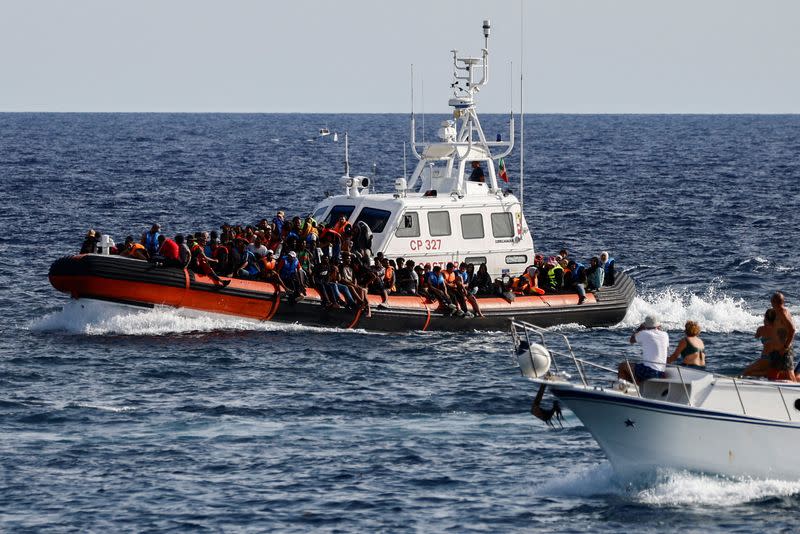 FILE PHOTO: Migrants in Lampedusa