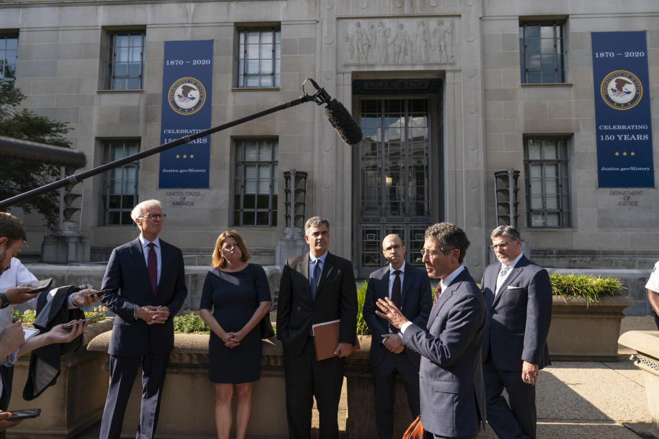 Bruce Brown, second from right executive director of the Reporters Committee for Freedom of the Press, speaks accompanied by Washington Post publisher Fred Ryan, left, Washington Post Executive Editor Sally Buzbee, Washington Post general counsel Jay Kennedy, New York Times Publisher A.G. Sulzberger, and CNN executive vice president and general counsel David Vigilante, right, after a meeting with Attorney General Merrick Garland at the Department of Justice, Monday, June 14, 2021, in Washington. (AP Photo/Alex Brandon)