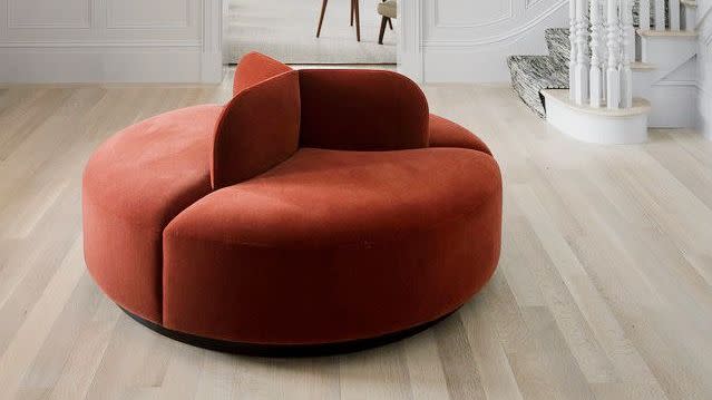 a living room with a red couch