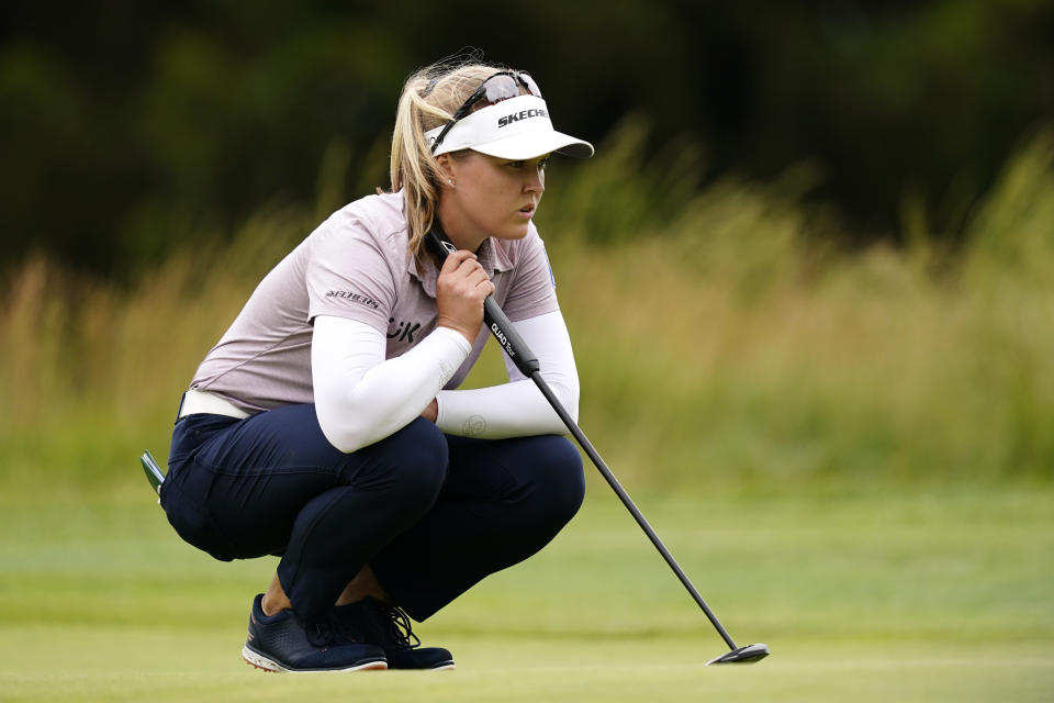 Brooke M. Henderson, of Canada, lines up a putt on the 13th green during the final round of the ShopRite LPGA Classic golf tournament, Sunday, June 12, 2022, in Galloway, N.J. (AP Photo/Matt Rourke)