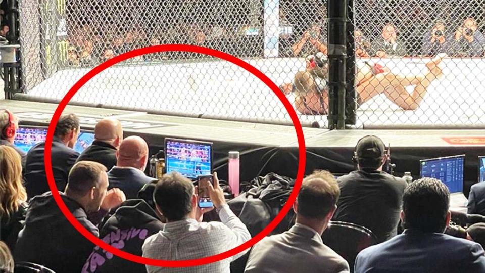 UFC President Dana White (pictured) watching the boxing on a monitor and the UFC co-main event.