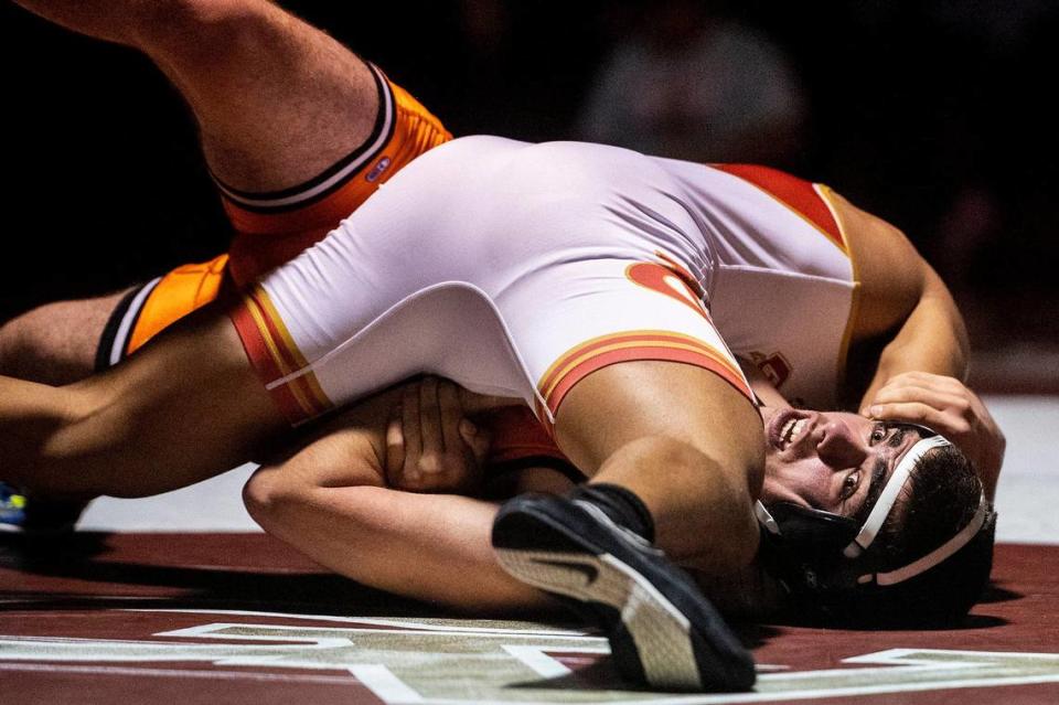 Merced’s Isiah Vera attempts to avoid being pinned by Golden Valley’s Isaac Le Blanc during a wrestling match at Golden Valley High School in Merced, Calif., on Tuesday, Jan. 23, 2024.