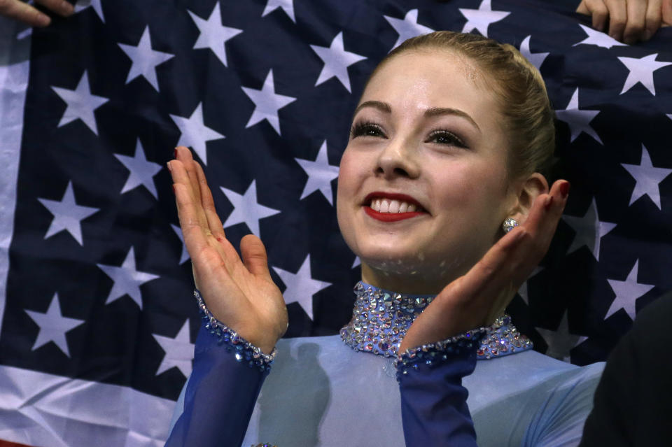 Gracie Gold of the United States applauds in the results area after competing in the women's team free skate figure skating competition at the Iceberg Skating Palace during the 2014 Winter Olympics, Sunday, Feb. 9, 2014, in Sochi, Russia. (AP Photo/Darron Cummings, Pool)