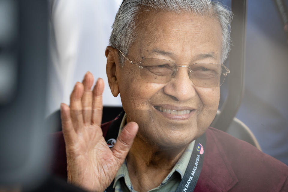 A picture of Malaysia's former prime minister, Mahathir Mohammad, waving.