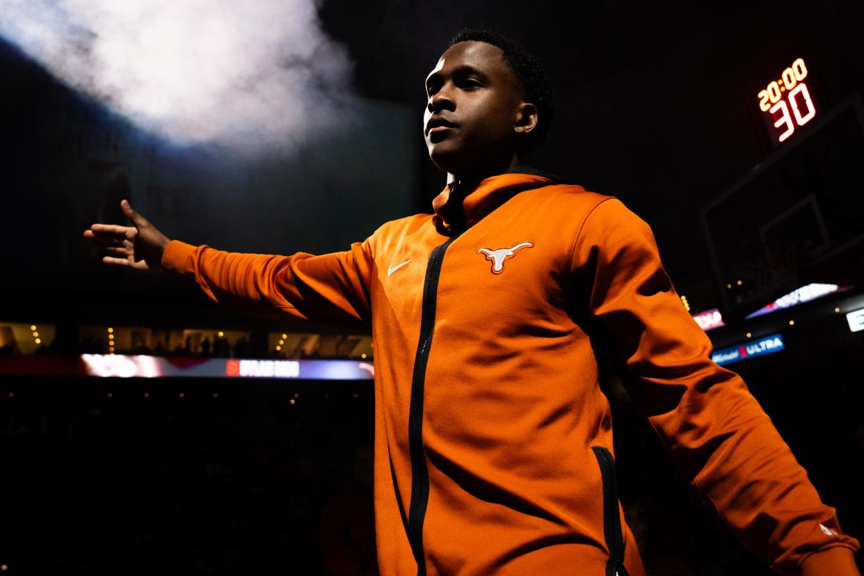 Texas Longhorns guard Max Abmas (3) gives out high-fives during the starting line-up announcement ahead of the Longhorns' game against the Oklahoma Sooners at the Moody Center in Austin, Saturday, March 9, 2024. Texas won the game 94-80.