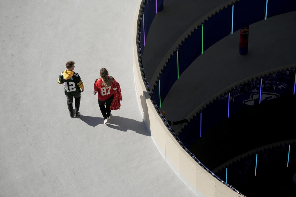 Fans make their way into Arrowhead Stadium before the start of an NFL football game between the Kansas City Chiefs and the Green Bay Packers Sunday, Nov. 7, 2021, in Kansas City, Mo. (AP Photo/Charlie Riedel)