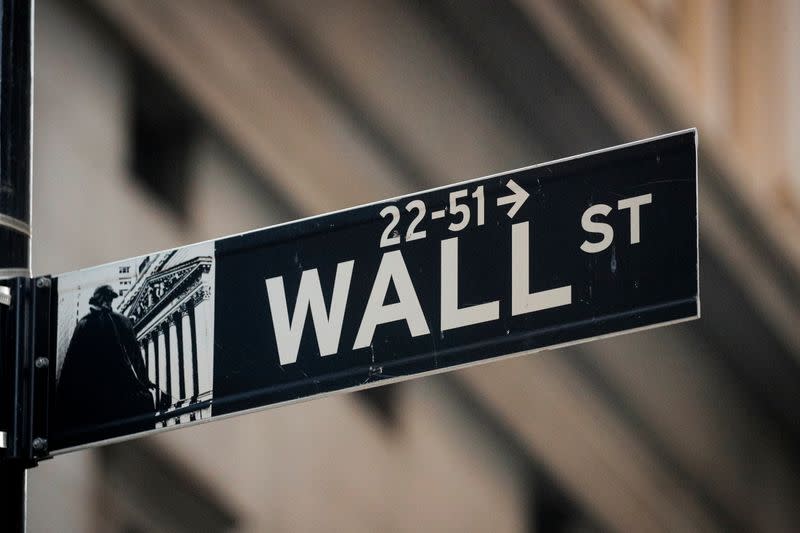 FILE PHOTO: A Wall St. sign is seen near the NYSE in the financial district in New York