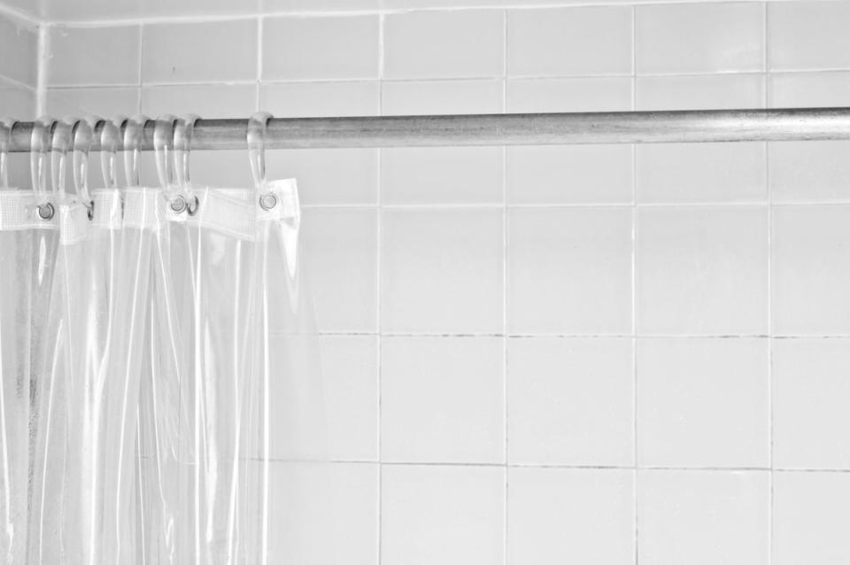 Clean shower liner on shower rod.