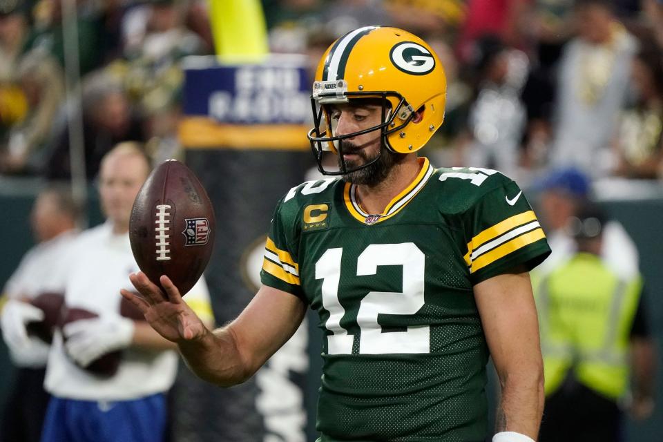 Aaron Rodgers warms up before a game against the Chicago Bears.