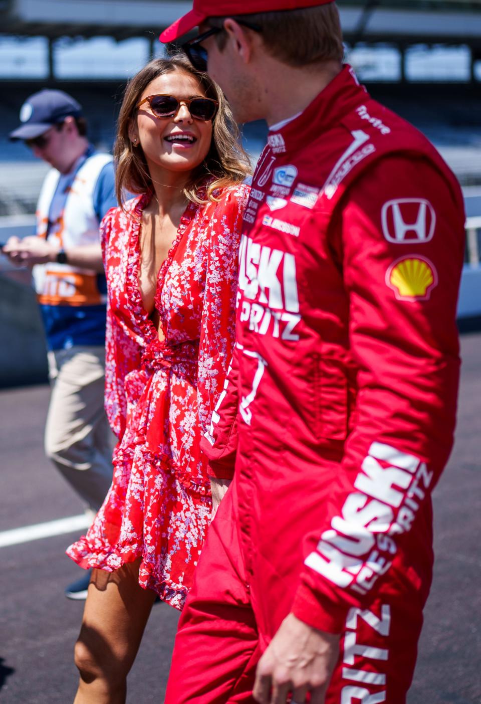 Chip Ganassi Racing driver Marcus Ericsson (8) laughs with girlfriend and model Iris Tritsaris Jondahl on Sunday, May 21, 2023, along pit lane prior to the Top 12 qualifying session at Indianapolis Motor Speedway in preparation for the 107th running of the Indianapolis 500.