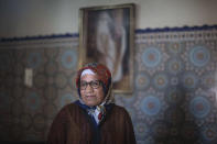 Ghita Naoui is seen inside her home as she spends Eid in lockdown with her family members due to the Coronavirus pandemic, in Sale, Morocco, Sunday, May 24, 2020. Instead of mass prayers and large family gatherings filled with colorful clothes, gifts, and traditional foods, millions of Moroccan Muslims celebrated Eid Al-Fitr at home, subdued and isolated amid their country's newly extended coronavirus lockdown. (AP Photo/Mosa'ab Elshamy)