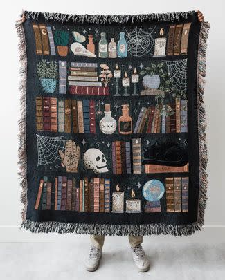 Or a witch's bookshelf throw to use while snuggling up with your scaredy-cat during the horror movie marathon you've tricked them into 