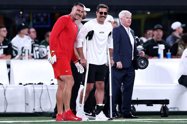 <p>Dustin Satloff/Getty </p> Travis Kelce #87 of the Kansas City Chiefs talks with injured Aaron Rodgers #8 of the New York Jets prior to the game at MetLife Stadium on October 01, 2023 in East Rutherford, New Jersey.