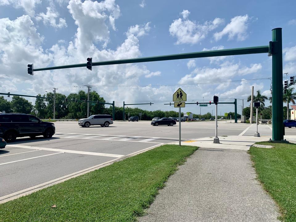 Cars make a left turn from Boynton Beach Boulevard onto Lyons Road. Blake Buchbinder, 13, was riding his bicycle in the northbound crosswalk (right) at the intersection of the streets Wednesday when he was hit and killed by a vehicle.